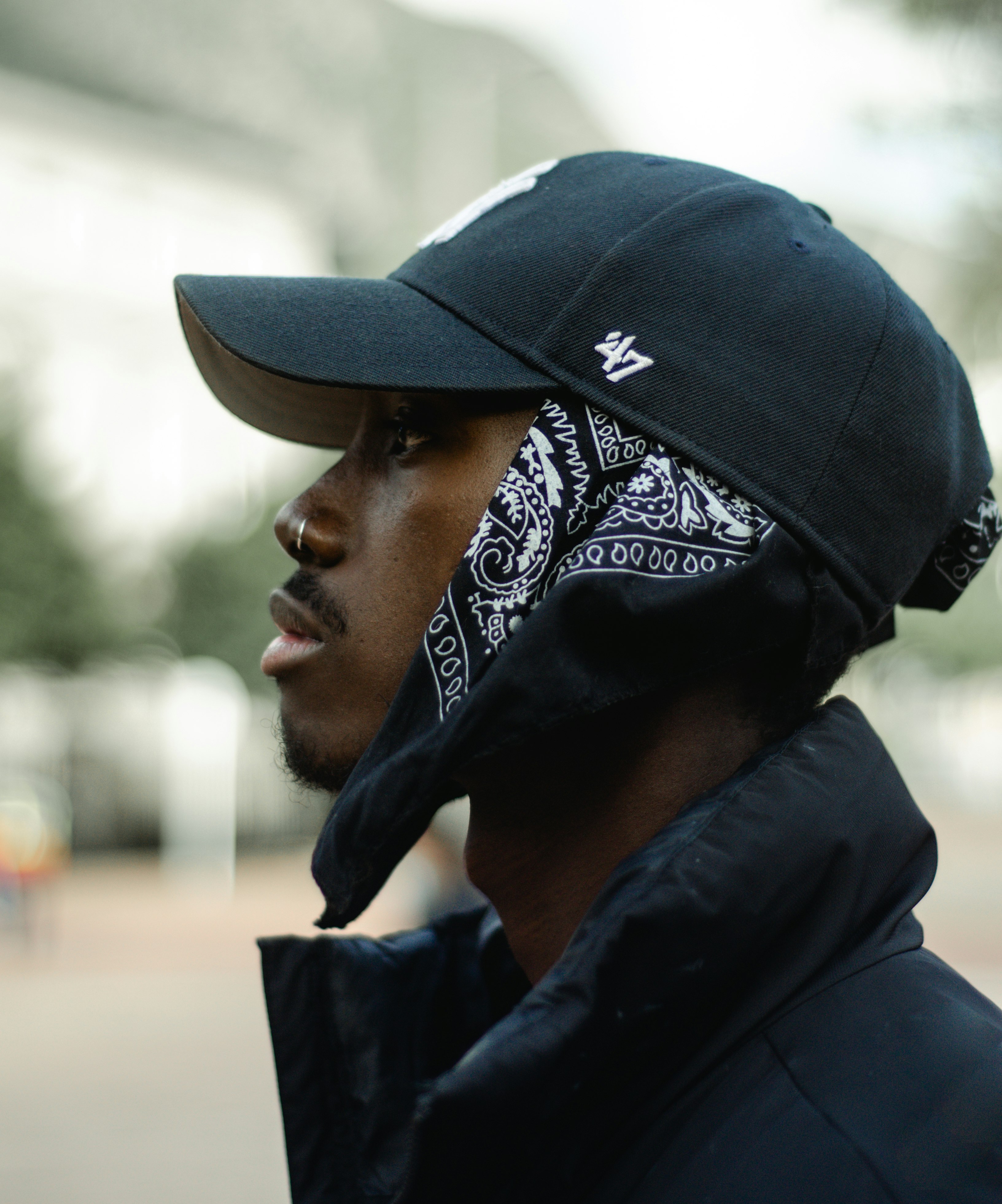 man in black and white floral bandana